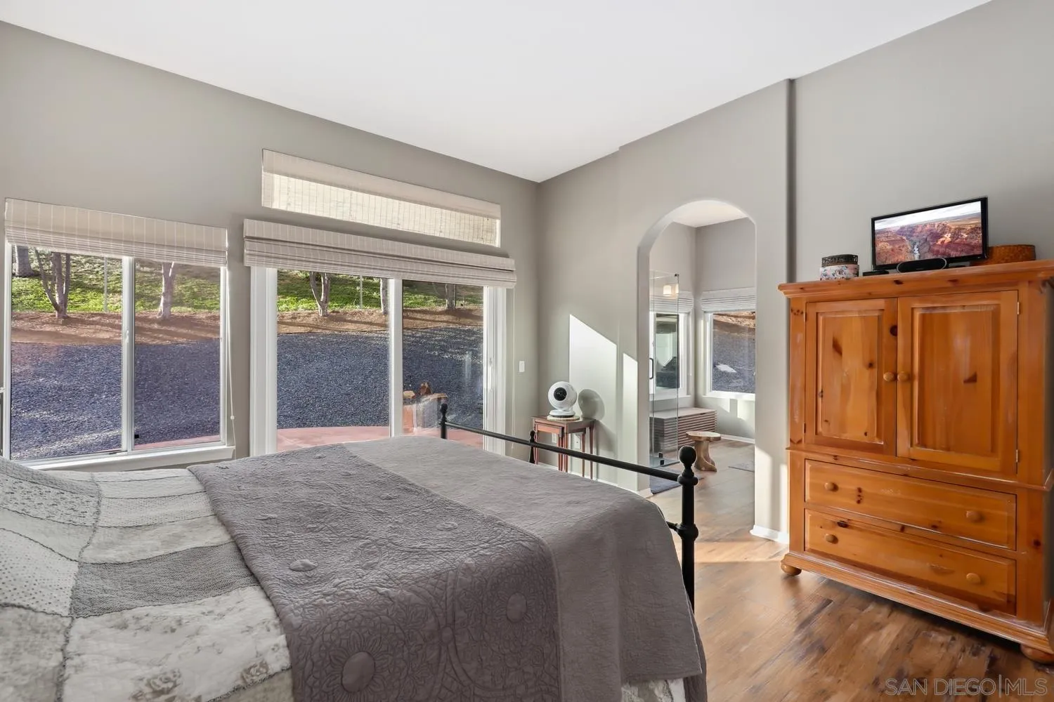 1783 Palomares Road Fallbrook, CA 92028 - Photo 16 of 40 a bedroom with a bed and wooden floor