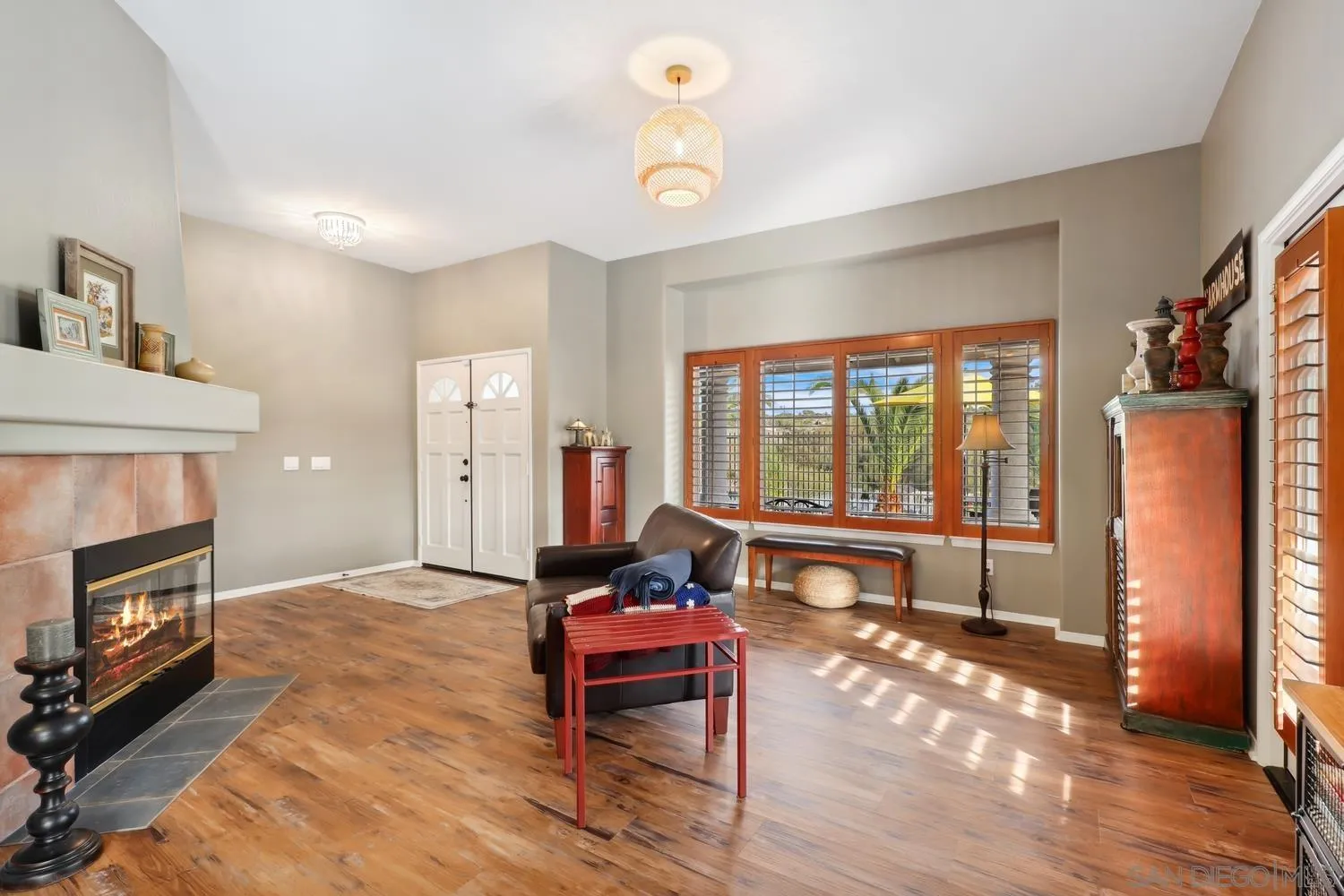 1783 Palomares Road Fallbrook, CA 92028 - Photo 8 of 40 a living room with furniture a fireplace and a table