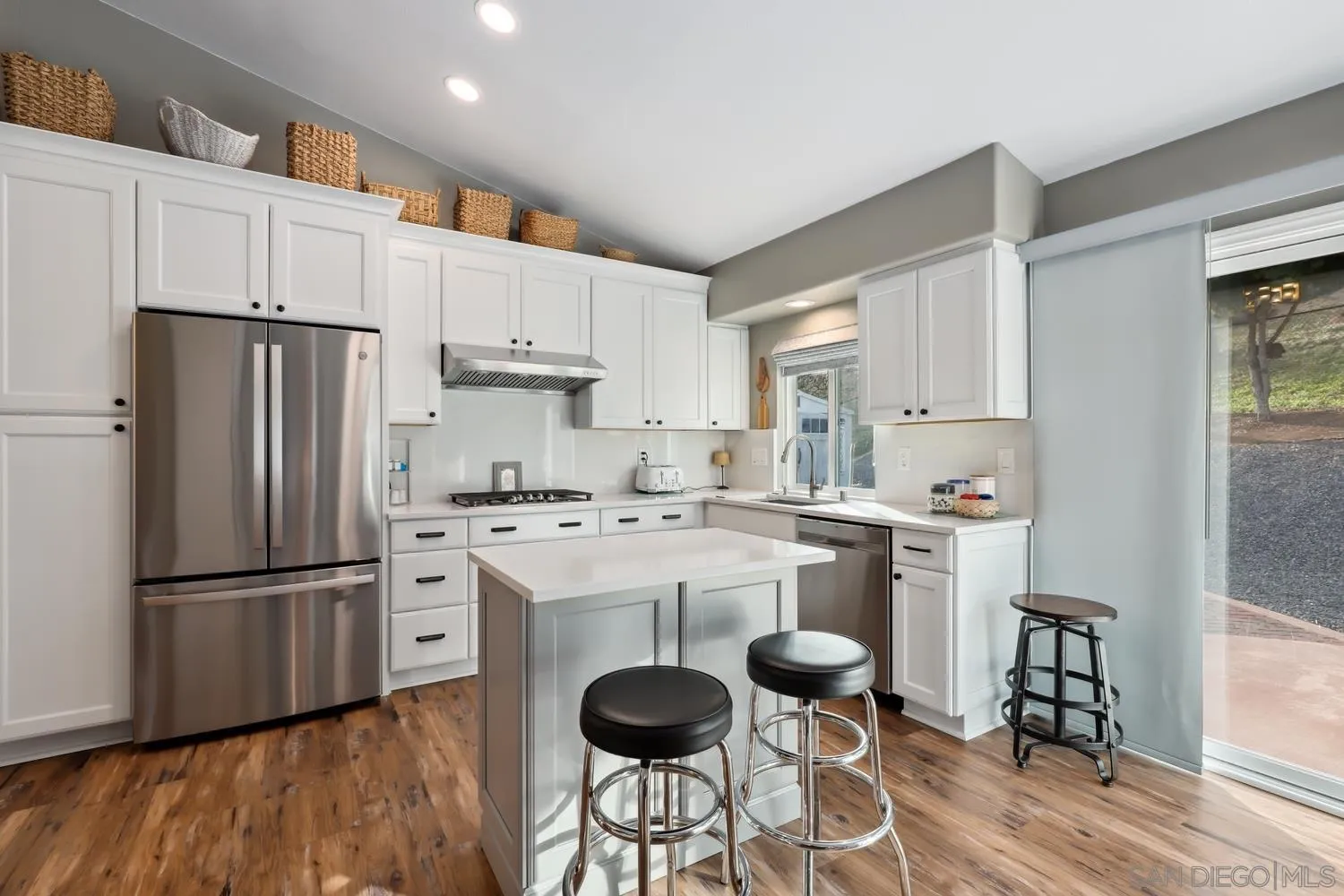 1783 Palomares Road Fallbrook, CA 92028 - Photo 9 of 40 a kitchen with stainless steel appliances a refrigerator stove microwave and cabinets