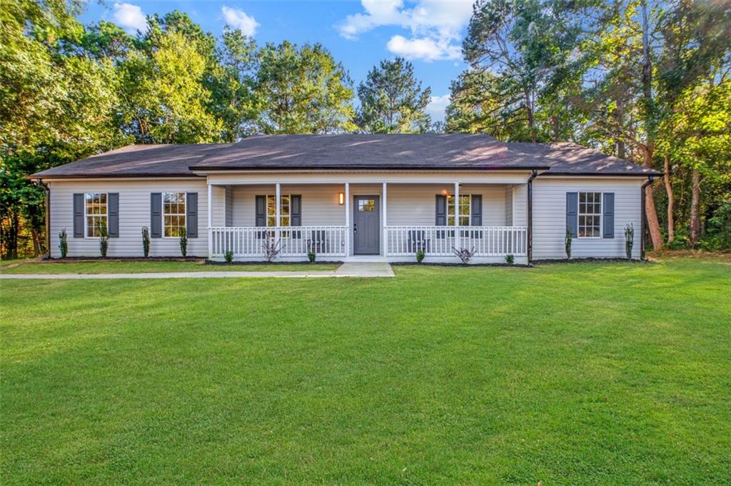 112 Will Clark Road Jefferson, GA 30549 - Photo 1 of 1 a house view with a garden space
