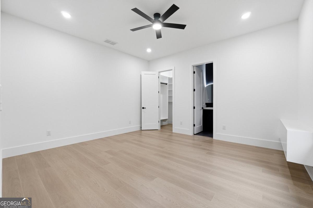 1563 Whitley Road Bethlehem, GA 30620 - Photo 24 of 44 an empty room with closet and a ceiling fan