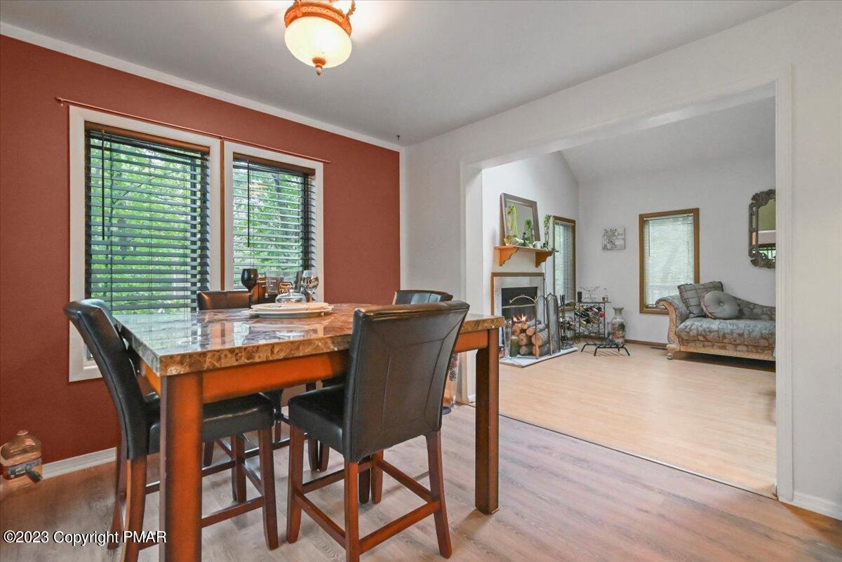 3237 Windemere Drive Bushkill, PA 18324 - Photo 12 of 50 a view of a dining room with furniture and wooden floor