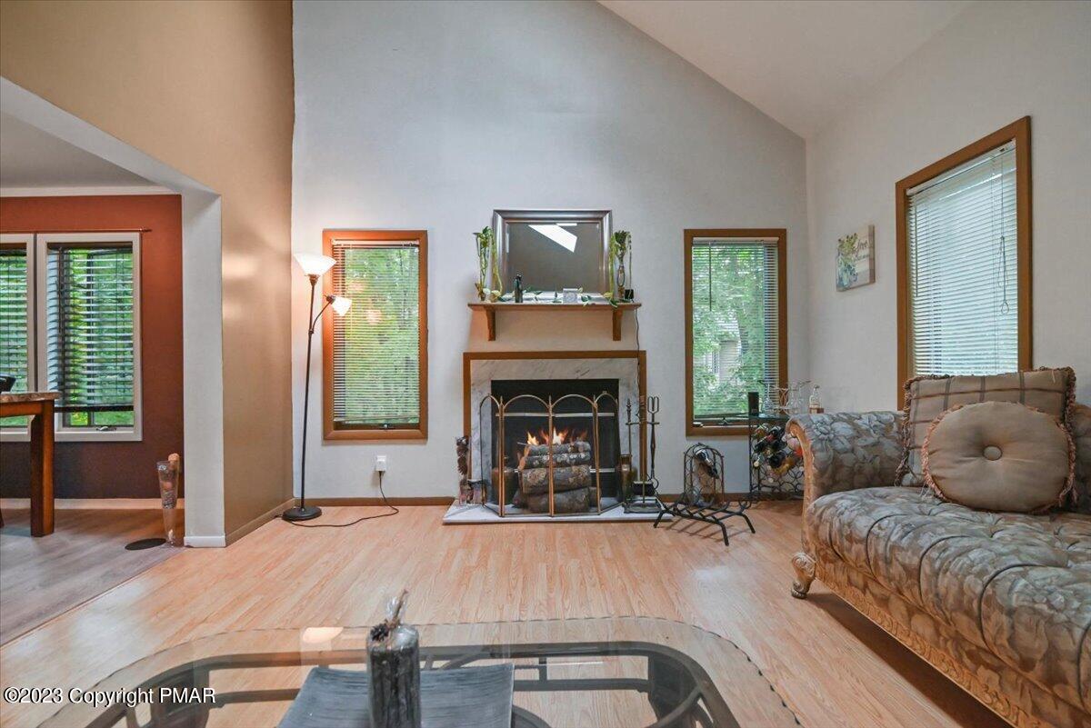 3237 Windemere Drive Bushkill, PA 18324 - Photo 13 of 50 a living room with furniture and a fireplace