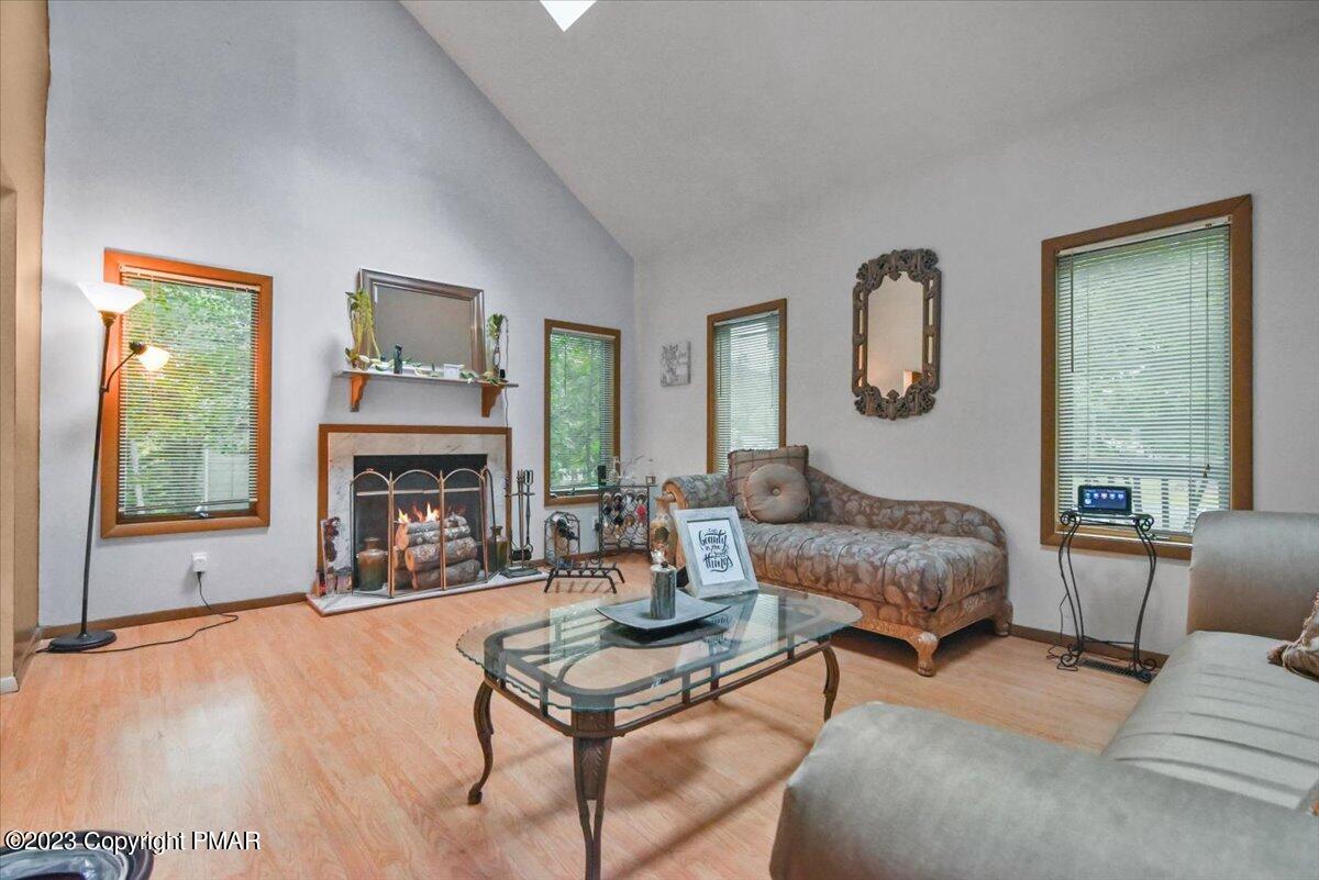 3237 Windemere Drive Bushkill, PA 18324 - Photo 14 of 50 a living room with furniture and a fireplace