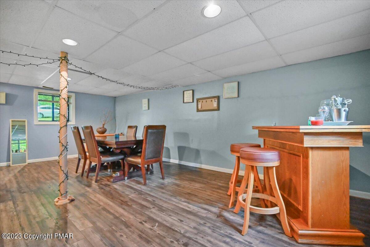 3237 Windemere Drive Bushkill, PA 18324 - Photo 32 of 50 a dining room with furniture and wooden floor