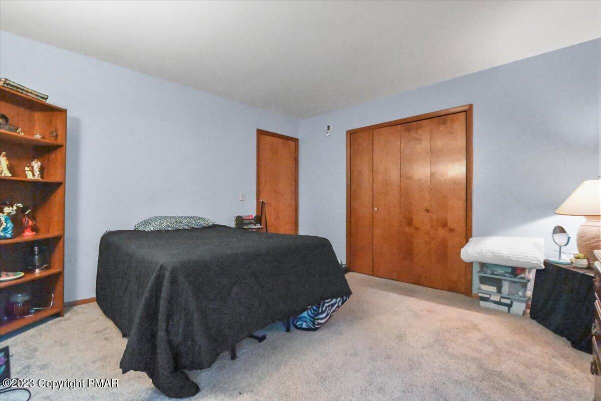 3237 Windemere Drive Bushkill, PA 18324 - Photo 39 of 50 a bedroom with a bed and a window