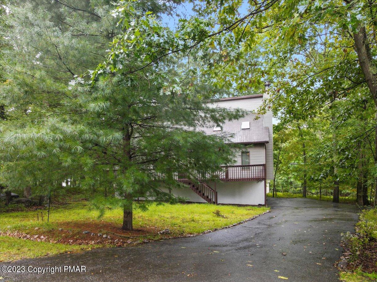 3237 Windemere Drive Bushkill, PA 18324 - Photo 4 of 50 a view of a house with a yard and large tree