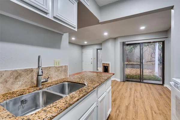 a view kitchen with a sink and large cabinets