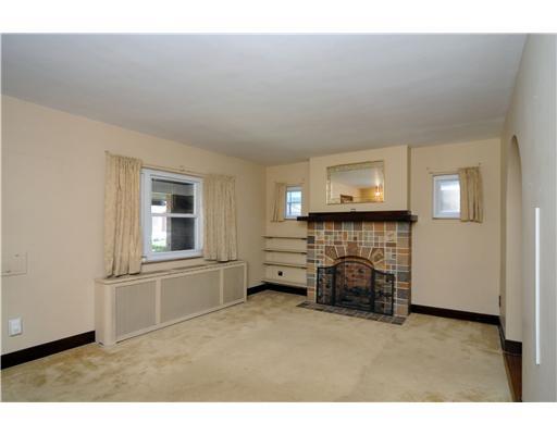 1013 2nd Street McKees Rocks, PA 15136 - Photo 3 of 16 Living Room. Decorative fireplace and original wood work!