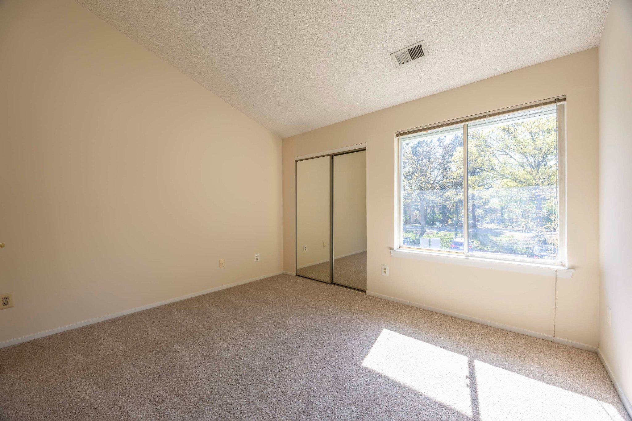11703 Summerchase Circle, Unit B Reston, VA 20194 - Photo 15 of 22 Main bedroom is bright and airy with a view.