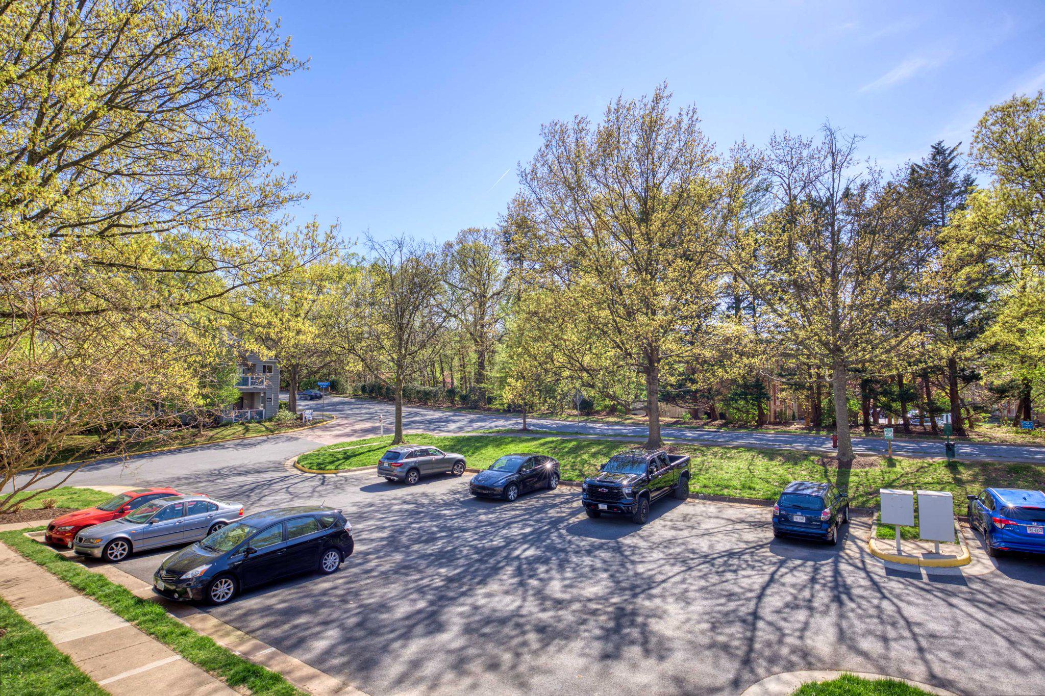 11703 Summerchase Circle, Unit B Reston, VA 20194 - Photo 20 of 22 Ample parking amidst lush greenery.