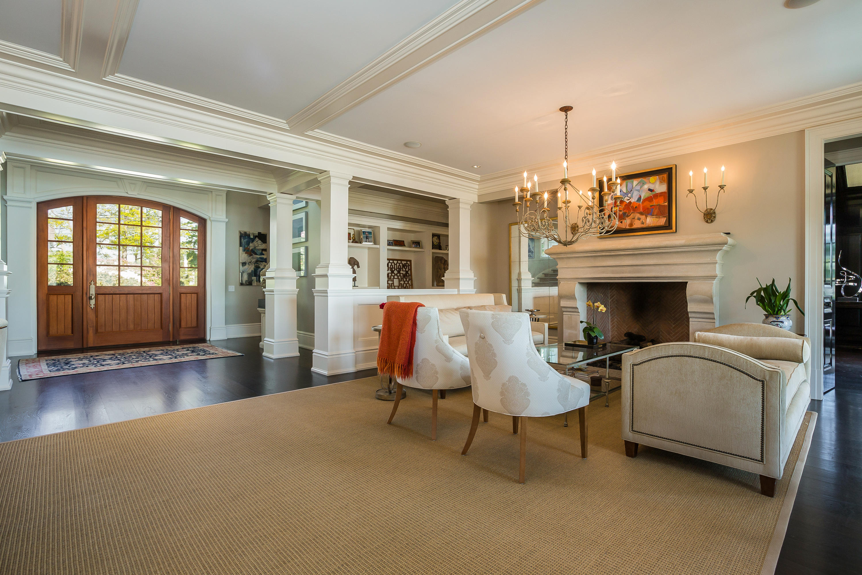 8 N Road Darien, CT 06820 - Photo 14 of 68 a living room with furniture a fireplace and a chandelier