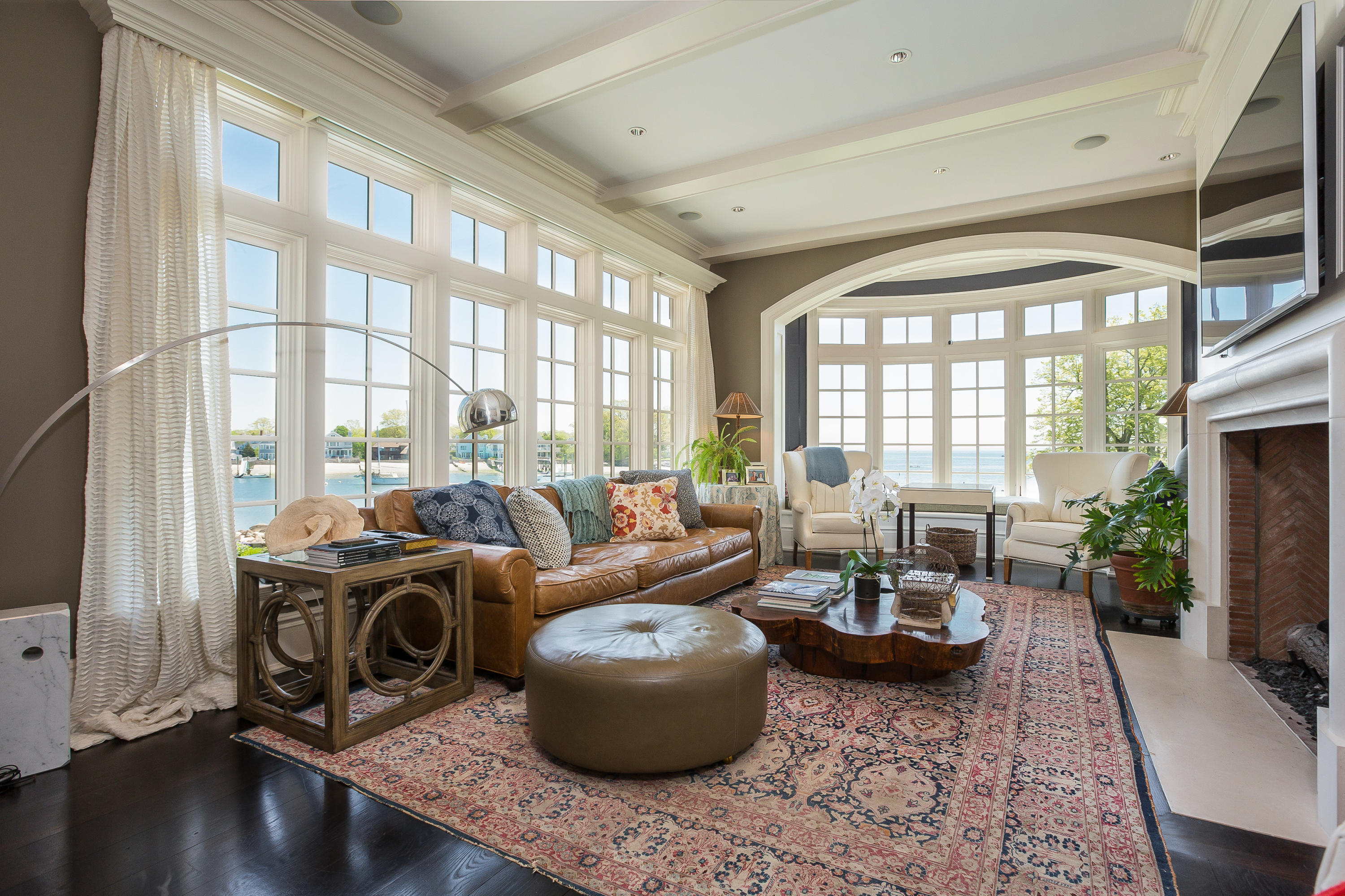 8 N Road Darien, CT 06820 - Photo 22 of 68 a living room with furniture large windows and wooden floor