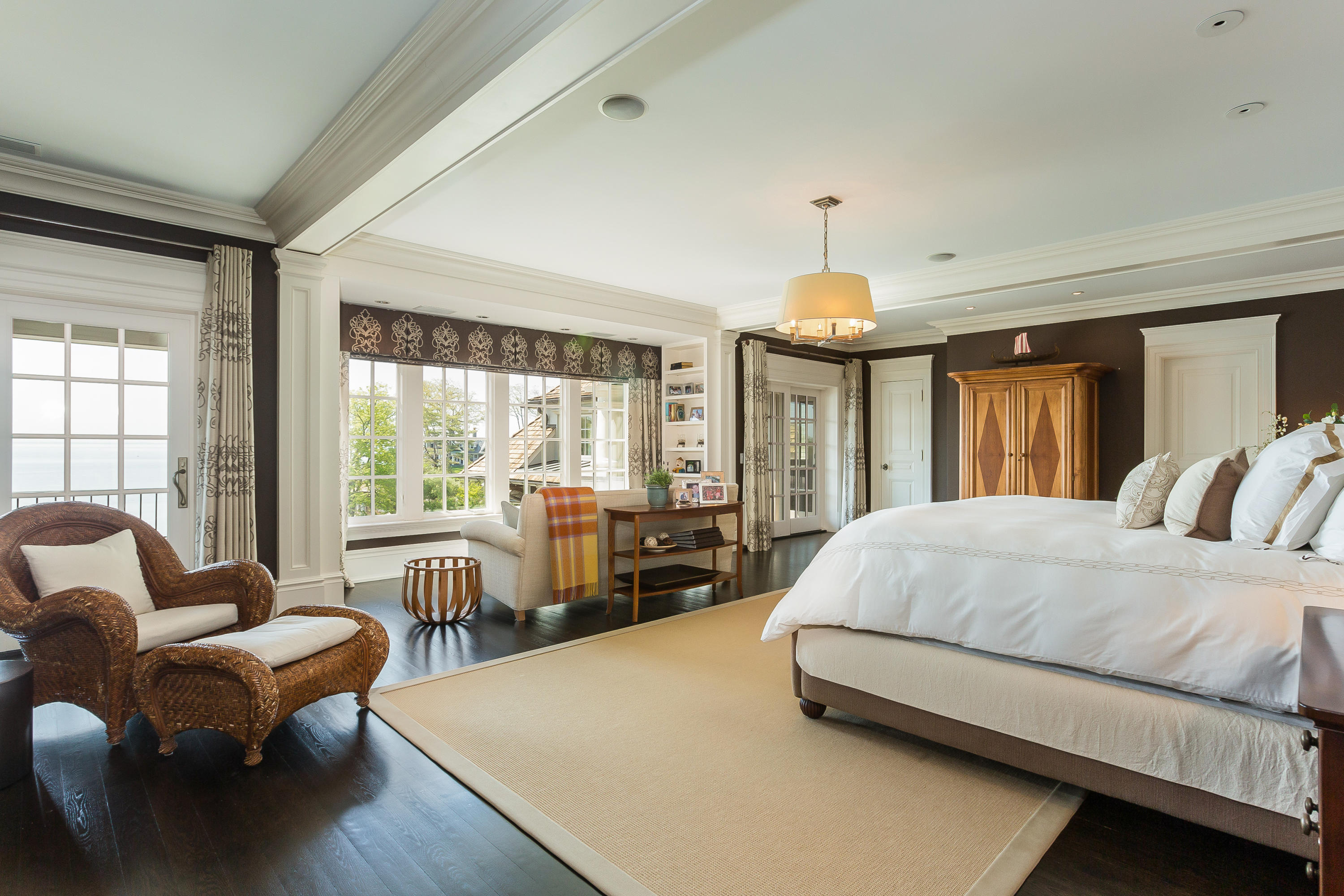 8 N Road Darien, CT 06820 - Photo 31 of 68 a spacious bedroom with a bed and large windows