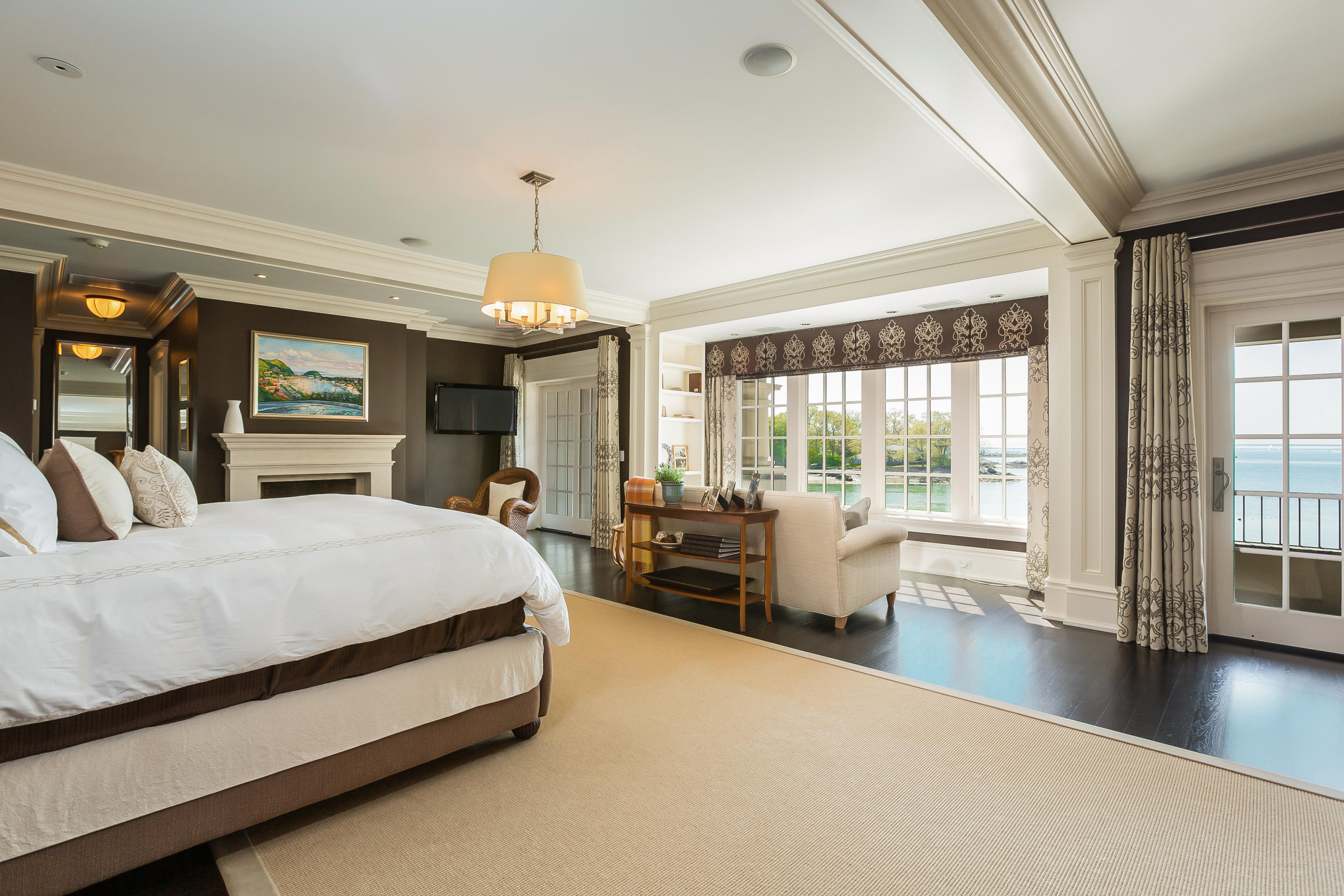 8 N Road Darien, CT 06820 - Photo 33 of 68 a spacious bedroom with a large bed and a large window