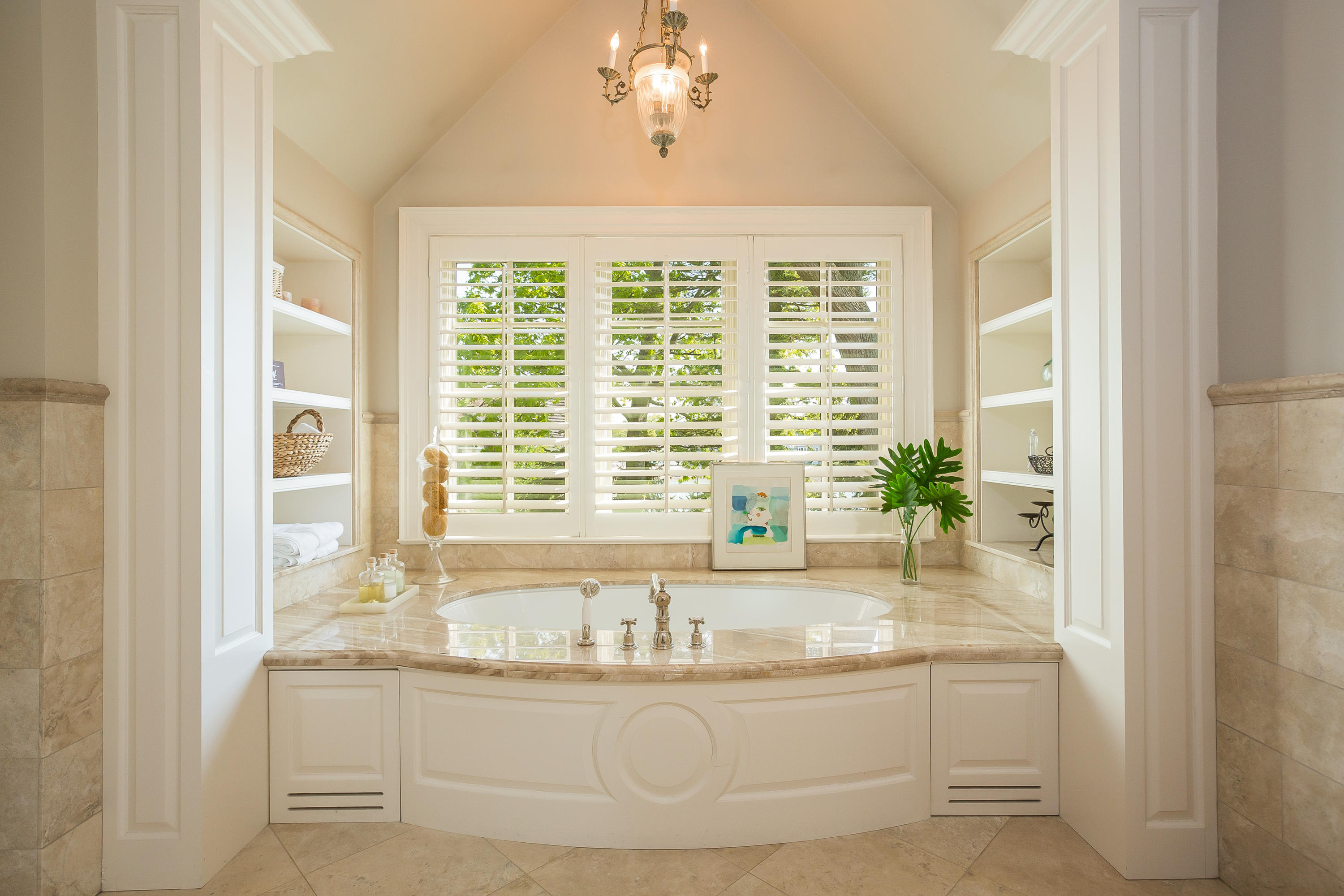 8 N Road Darien, CT 06820 - Photo 35 of 68 a bathroom with granite countertop a sink and a large mirror next to a window