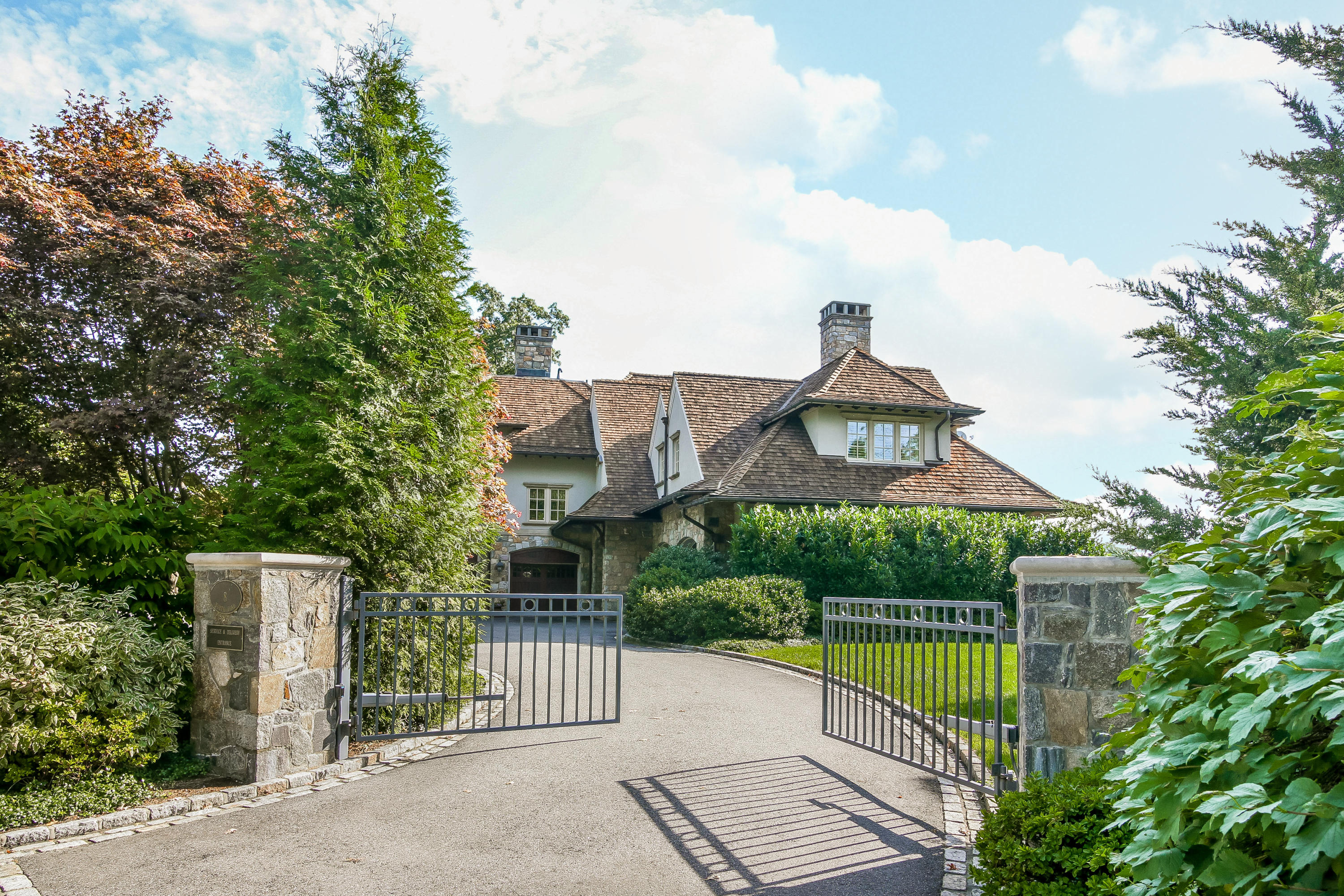 8 N Road Darien, CT 06820 - Photo 4 of 68 a front view of a house with a garden