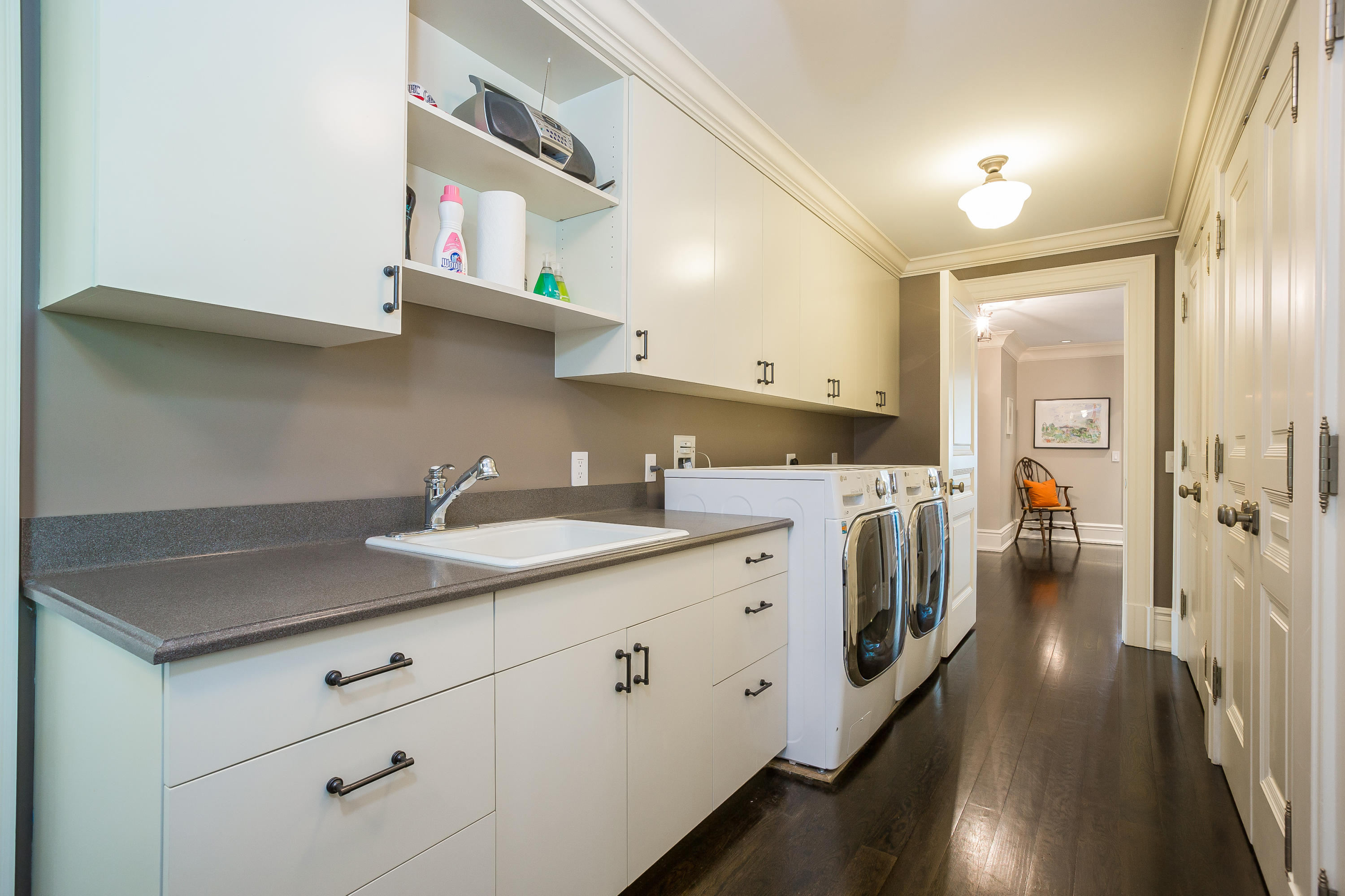 8 N Road Darien, CT 06820 - Photo 46 of 68 a kitchen with cabinets and wooden floor