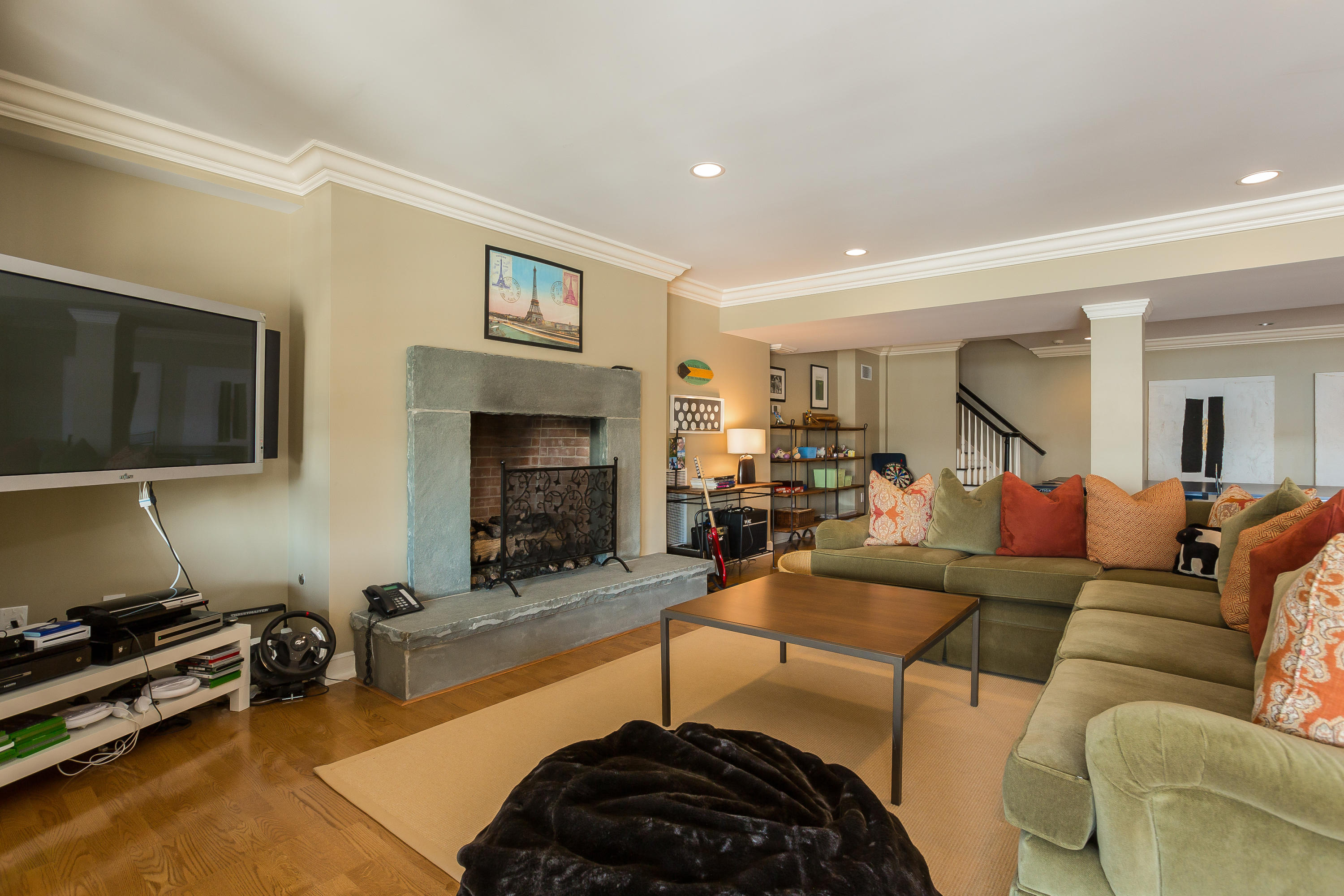 8 N Road Darien, CT 06820 - Photo 47 of 68 a living room with furniture a flat screen tv and a fireplace