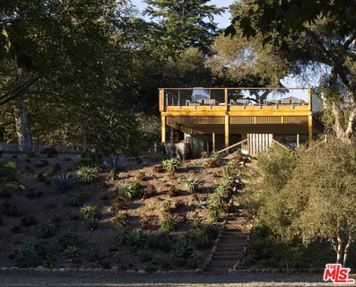 a kitchen with granite countertop a stove and a sink