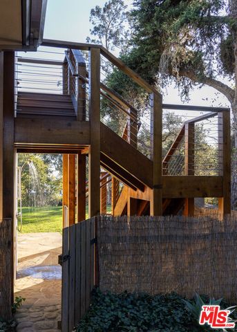 a bedroom with a large bed and a large window