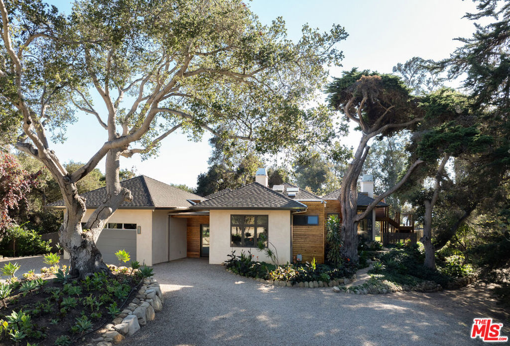2937 Padaro Lane Carpinteria, CA 93013 - Photo 5 of 32 a front view of a house with a garden