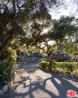 a pathway of a house with a yard