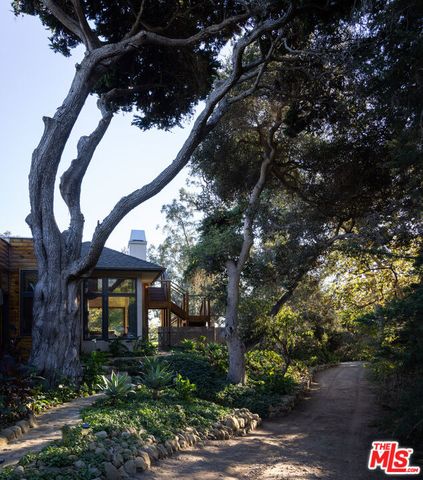 a view of a house with a tree