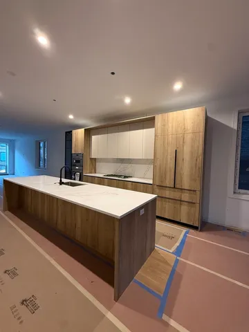 a kitchen with stainless steel appliances granite countertop a sink and a stove