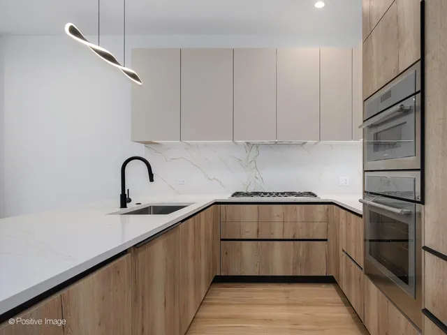 a kitchen with a sink and cabinets