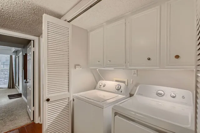 a view of storage and utility room with washer and dryer