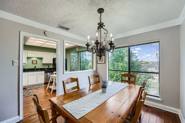 a view of a dining room with furniture window and outside view