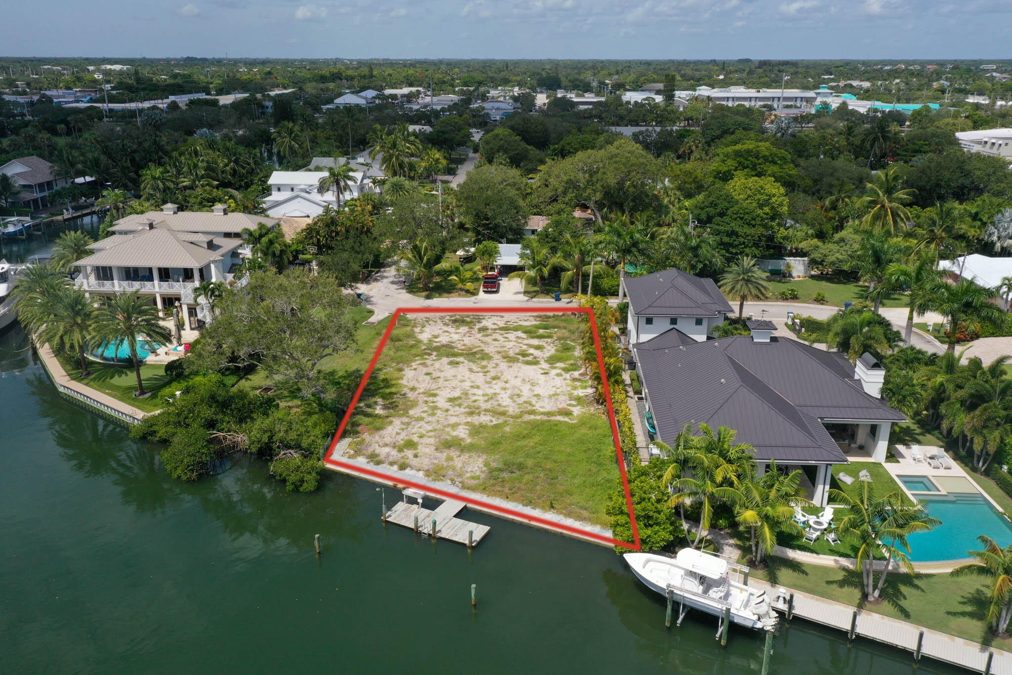 601 Waldemar Road Jupiter, FL 33477 - Photo 13 of 19 an aerial view of a house with a garden and lake view