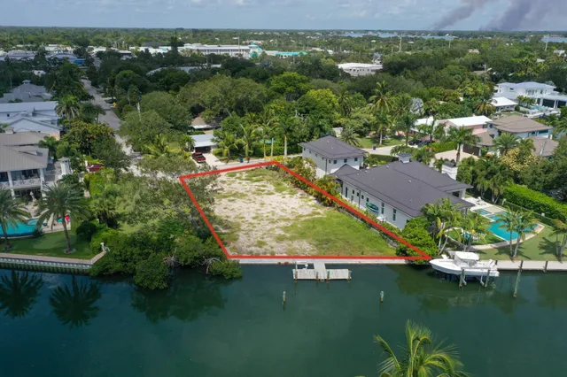 an aerial view of a house with a lake view