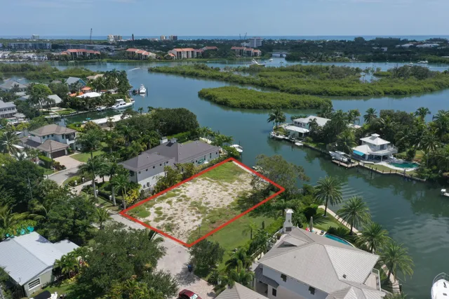 an aerial view of lake residential house with outdoor space and seating