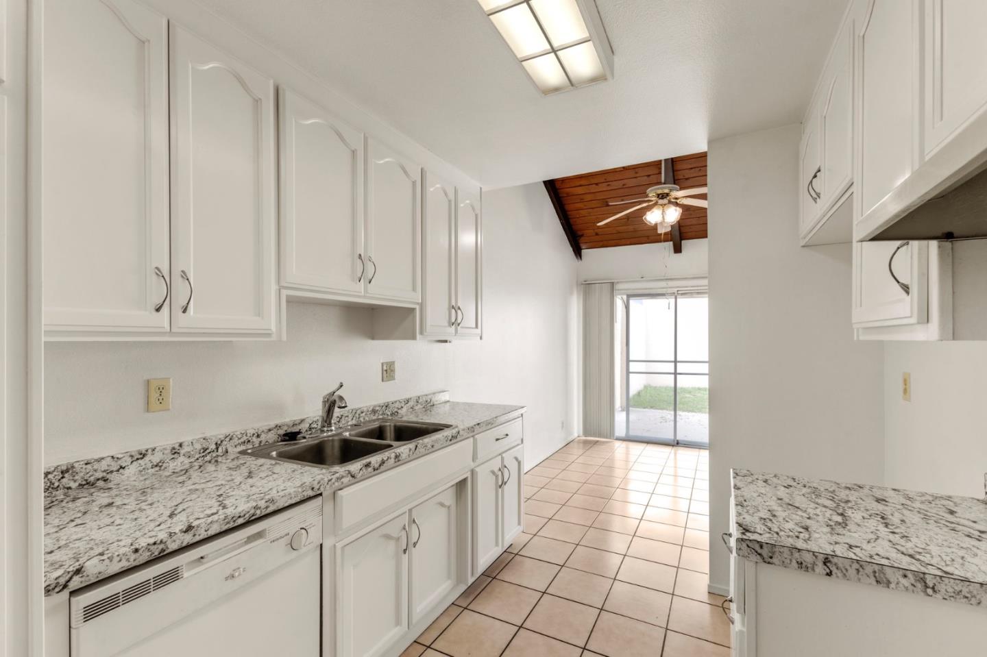 1604 Cherokee Drive Salinas, CA 93906 - Photo 11 of 22 a kitchen with stainless steel appliances granite countertop a sink stove and cabinets