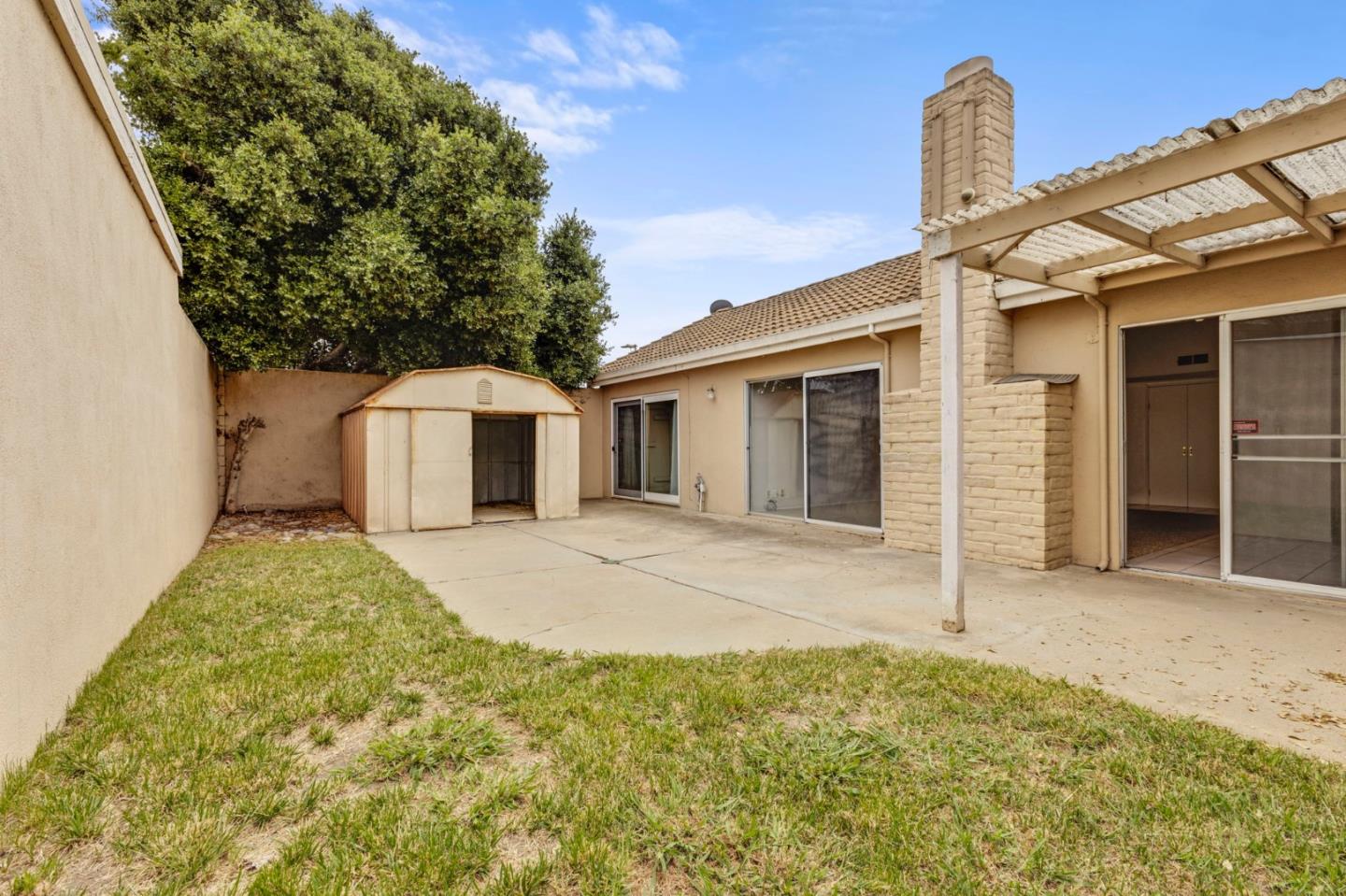1604 Cherokee Drive Salinas, CA 93906 - Photo 18 of 22 a front view of a house with a yard and garage