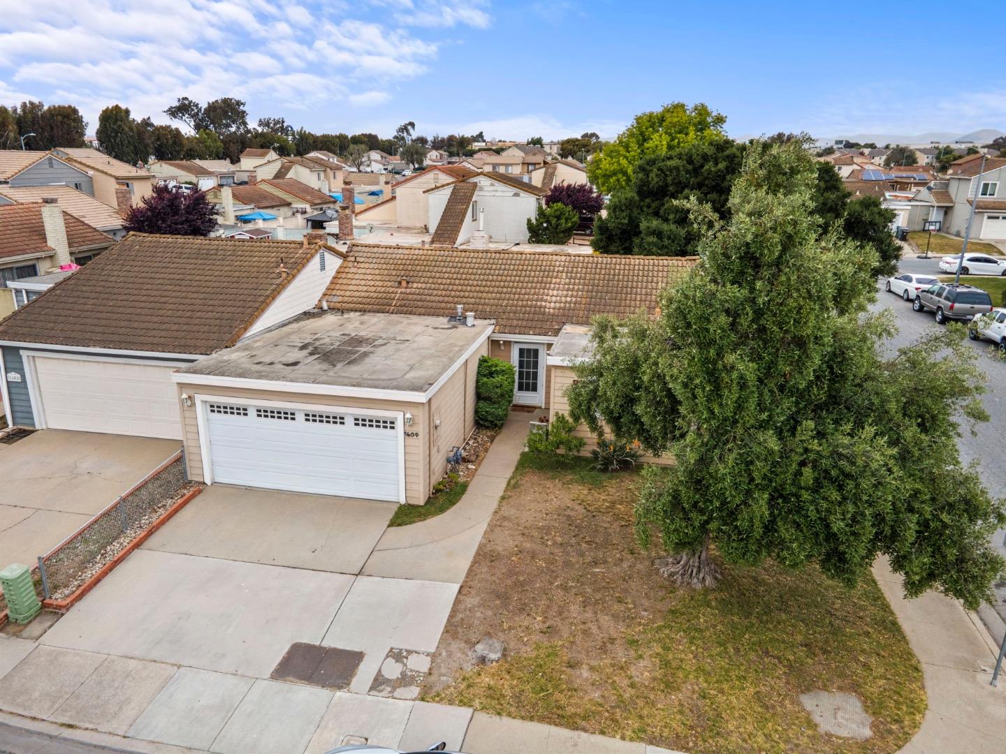 1604 Cherokee Drive Salinas, CA 93906 - Photo 2 of 22 an aerial view of a house with a yard garage and lake view