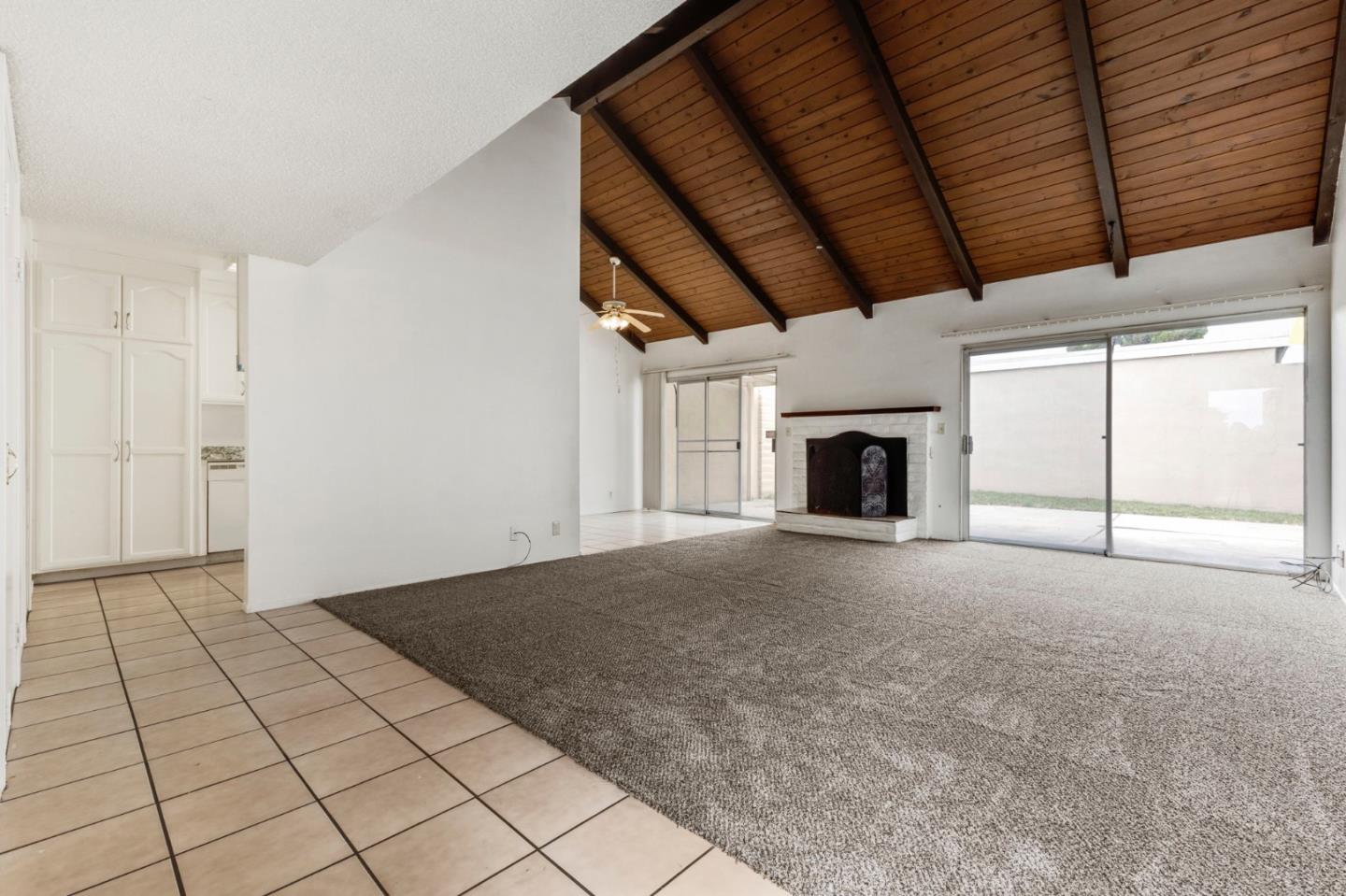 1604 Cherokee Drive Salinas, CA 93906 - Photo 4 of 22 an empty room with fireplace and windows