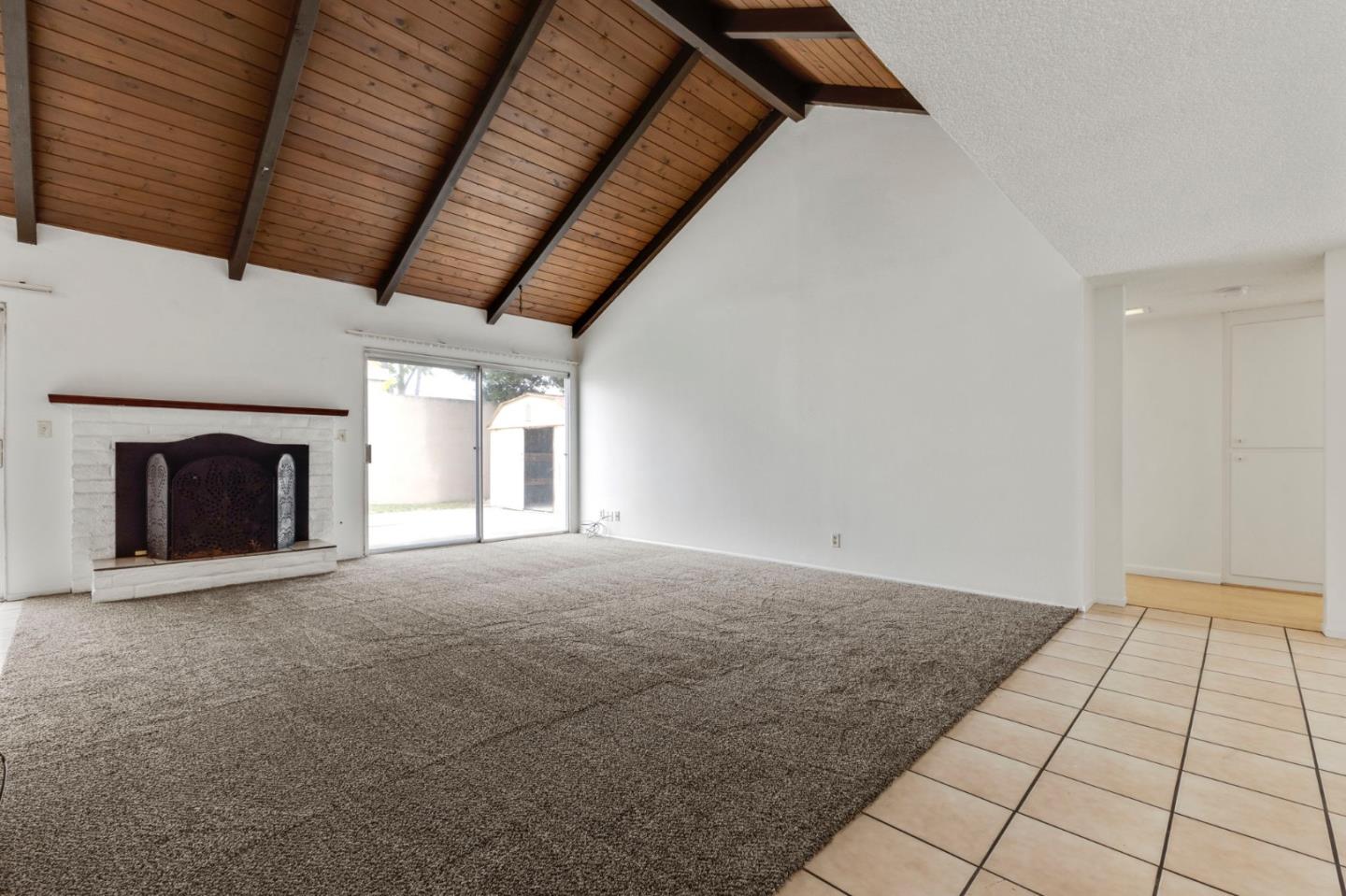 1604 Cherokee Drive Salinas, CA 93906 - Photo 5 of 22 a view of an empty room with a fireplace and a window