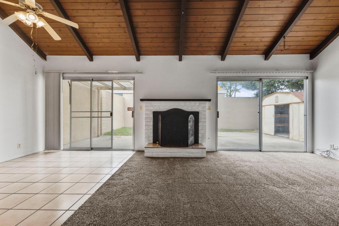 1604 Cherokee Drive Salinas, CA 93906 - Photo 8 of 22 a view of an empty room with a fireplace and a window