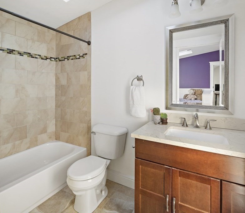 20 Hall Avenue, Unit 2 Somerville, MA 02144 - Photo 12 of 18 a bathroom with a sink a toilet and a bathtub