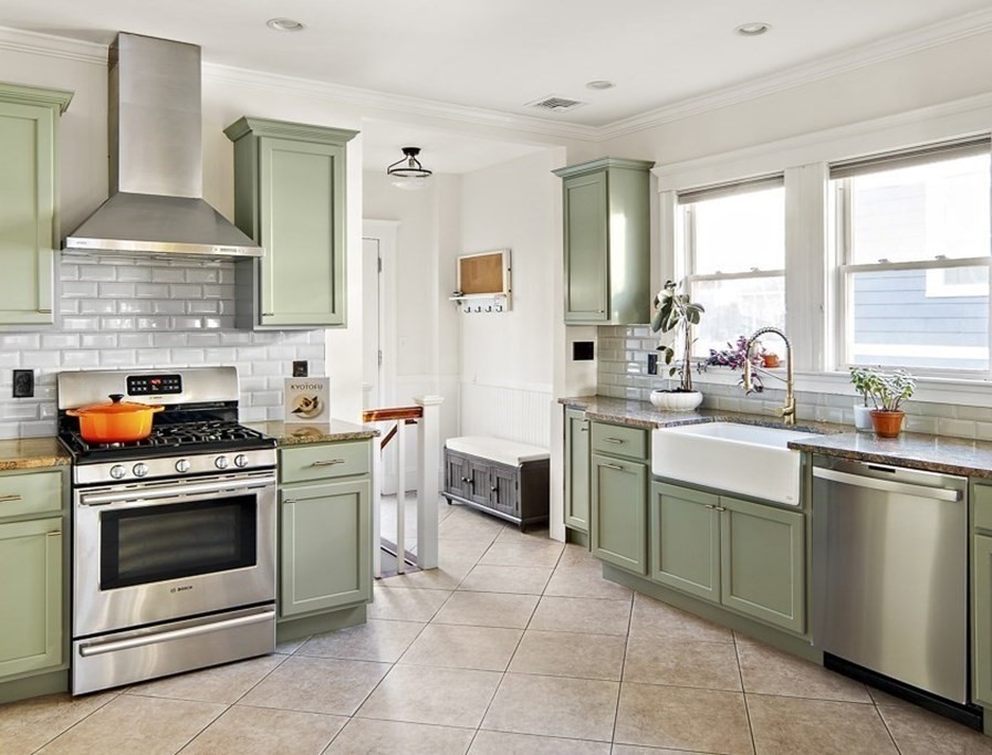 20 Hall Avenue, Unit 2 Somerville, MA 02144 - Photo 6 of 18 a kitchen with a stove sink and cabinets