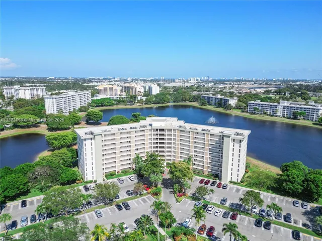 an aerial view of a house with a lake view