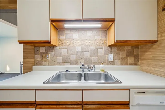 a kitchen with a sink and a window