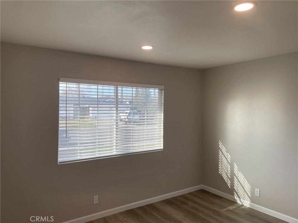 820 North Lassen Street Willows, CA 95988 - Photo 18 of 18 a view of an empty room with wooden floor and a window