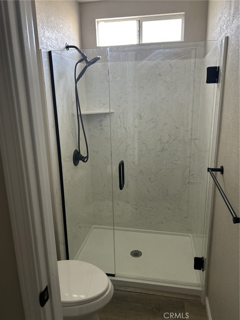 820 North Lassen Street Willows, CA 95988 - Photo 10 of 18 a bathroom with a shower and a toilet