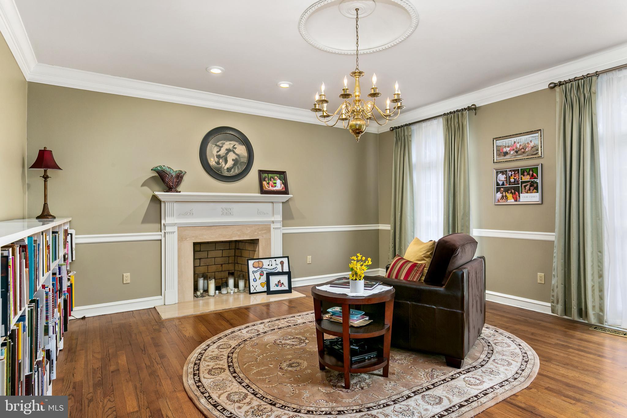 2 Teaberry Drive Medford, NJ 08055 - Photo 3 of 43 a living room with furniture a fireplace and a chandelier