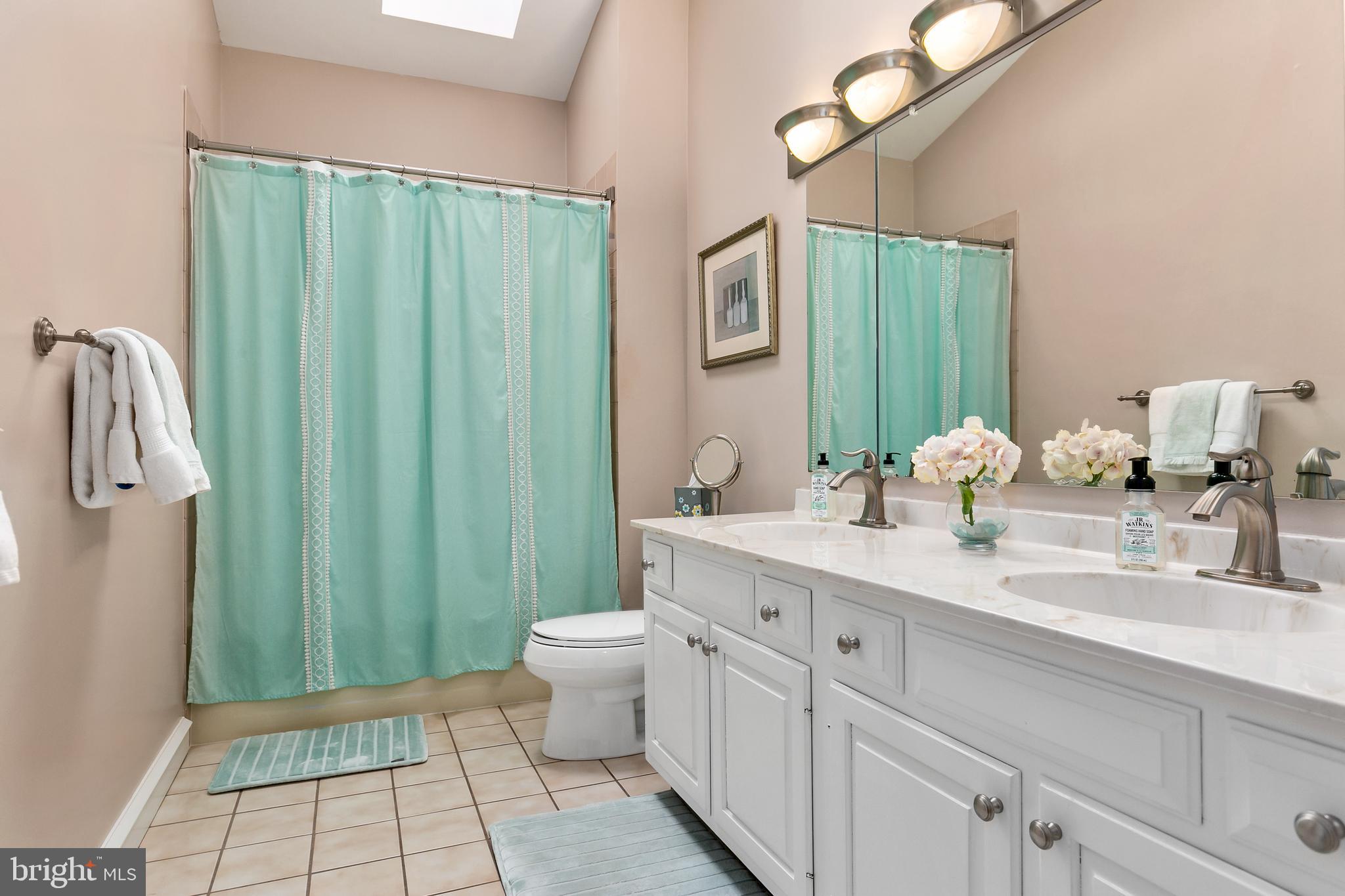 2 Teaberry Drive Medford, NJ 08055 - Photo 24 of 43 a bathroom with a granite countertop sink a toilet and a mirror