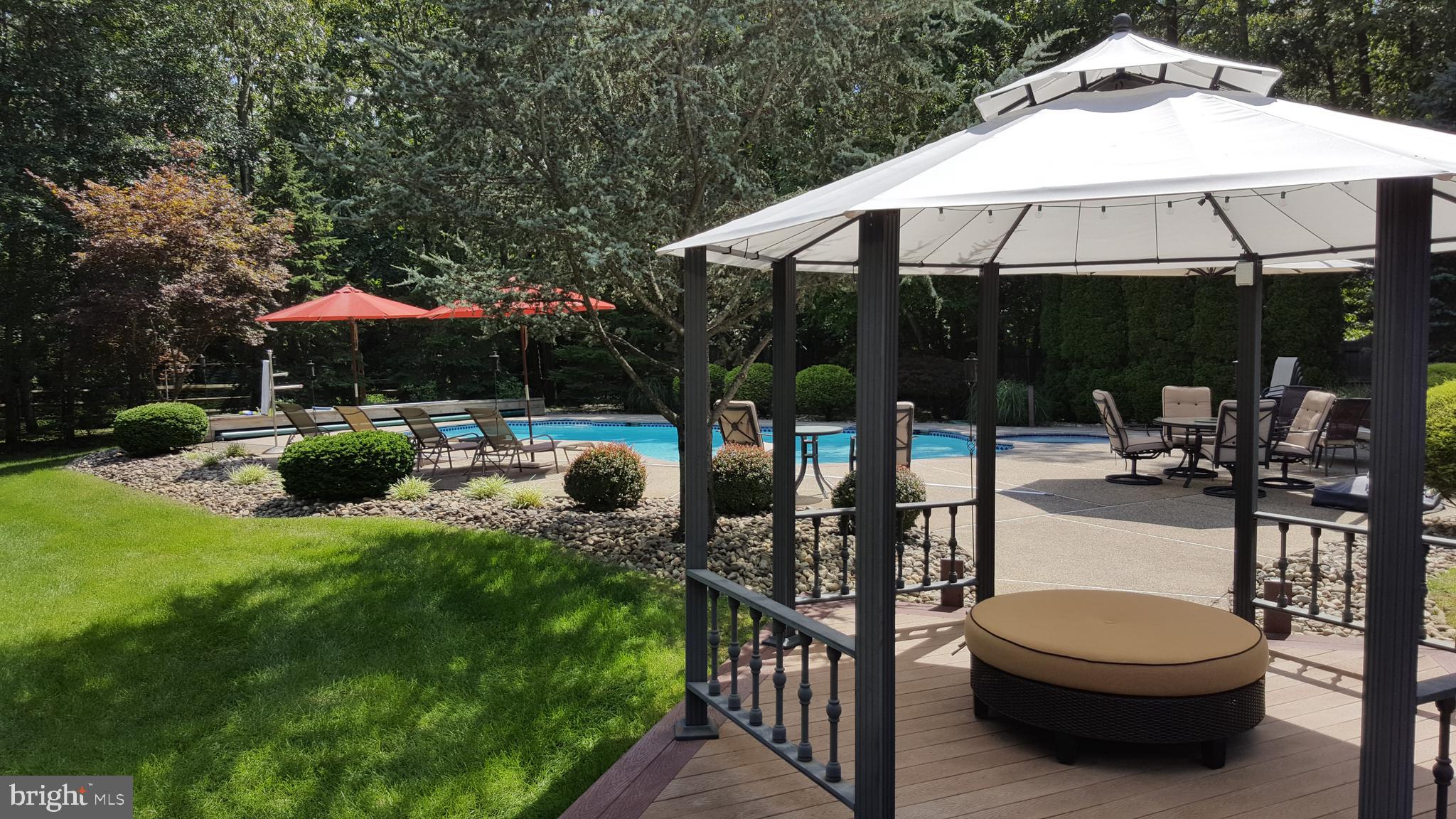 2 Teaberry Drive Medford, NJ 08055 - Photo 34 of 43 an outdoor space with furniture and umbrella